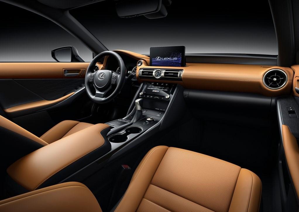 Leather seats and interior look rich and luxurious, in a car. 